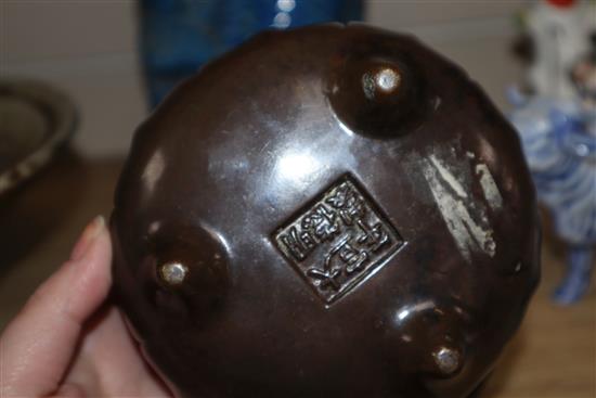 A Chinese bronze tripod censer and stand